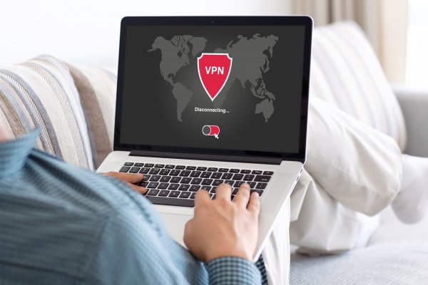 man on laptop vpn services typing